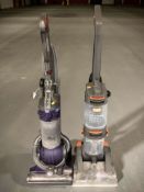 A Dyson vacuum and a Vax vacuum.