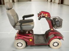 A Rascal mobility scooter with charger and key