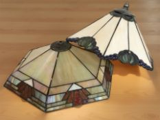 Two Tiffany style stained and leaded glass hexagonal ceiling light shades, the larger 36 cm wide.