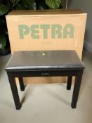 A Yamaha piano stool and a boxed Petra folding card table