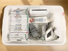 A Nintendo Wii console, accessories and various games.
