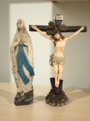 A resin crucifix and a further plaster figure of The Virgin Mary,