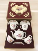 A Royal Crown Derby Derby Posies porcelain tea for two, in box.