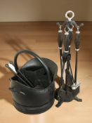A reproduction metal fire companion set and a coal bucket.