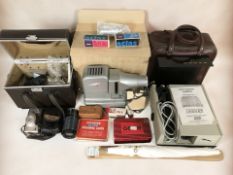 Two Gnome projectors, various accessories, Sirius auto zoom camera lens, Canon Z135 camera,