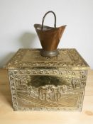 An embossed brass coal box, width 51 cm, and a copper swing handled basket.