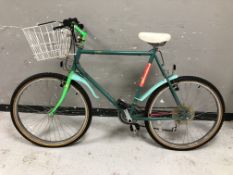 A Townsend bike with front shopping basket,