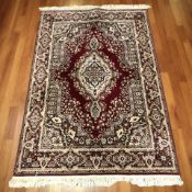 A machined rug of Iranian design,