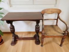 A stained wooden refectory occasional table and a Victorian armchair.