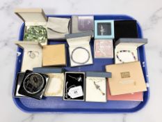 Assorted costume jewellery including pendants and bracelets, two Laura Geller makeup sets,