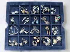 Approximately 23 pairs of silver/white metal earrings,