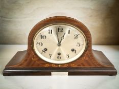 An early 20th century mahogany and satinwood inlaid chiming eight day mantel clock with silvered