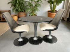 A 20th century oval pedestal table and a matching pair of perspex swivel chairs with cream leather
