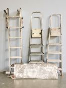Three aluminium ladders and a platform.