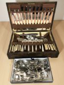 An oak canteen of Sheffield stainless steel cutlery and a quantity of loose EPNS and stainless