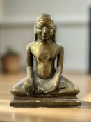 A brass figure of Buddha