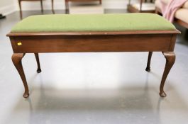 A 20th century stained beech storage piano duet stool on pad feet, width 110 cm.