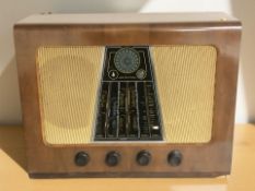 A vintage walnut cased Bush valve radio, width 62 cm.