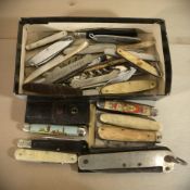 A group of vintage folding pocket knives, a military issue jackknife stamped 'M&D, Canada, 1914',