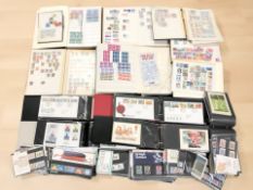 Seven stamp albums containing a large quantity of British and World stamps including numerous Royal