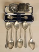 A set of six silver golf themed teaspoons,