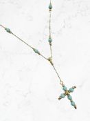A 9ct gold faux-turquoise crucifix pendant on chain CONDITION REPORT: 3.