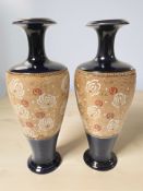 A pair of Royal Doulton Lambeth stoneware cobalt blue and gilt vases, height 25 cm.