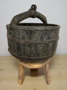 A 19th century oriental metal bound wooden water carrying bucket, diameter 50 cm,