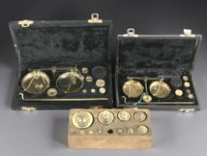 A group of 19th century graduated weights in oak block,