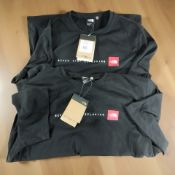 Two The North Face men's black t-shirts sizes small and XL, both with retail tags.