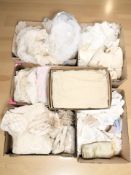 A collection of vintage lace veils, doilies, silk night dresses and other similar clothing.