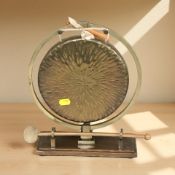 A brass dinner gong with beater, height 31 cm.