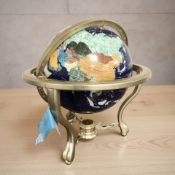 A gemstone globe, height 46 cm.