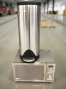 A Russell Hobbs stainless steel microwave and a pedal bin.
