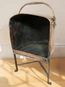 A 19th century copper plate warming stand with swing handle, height 65 cm.