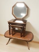 A G-Plan mahogany oval coffee table, a nest of two tables and an octagonal bevelled mirror.