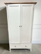 A modern pine and MDF double door wardrobe,