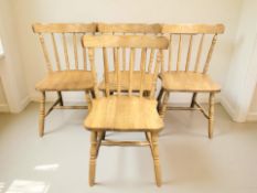 A reproduction set of four rubber wood plantation spindle back chairs.