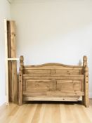 A modern pine 5' bed frame