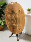 A Victorian figured walnut and satinwood inlaid oval breakfast table, width 120 cm.