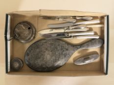 Assorted silver items including a hand mirror, salt with blue glass liner, nail buffer,