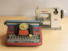 A vintage Mettype Junior enameled toy typewriter,