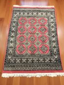 A Lahore Bokhara rug, Pakistan, 195 cm x 125 cm.