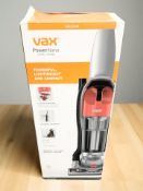 A Vax Power Nano vacuum cleaner in box.