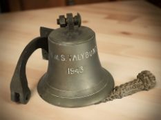 A metal ship's bell with bracket and clapper, stamped 'HMS Talybont, 1943', bell 16 cm high,