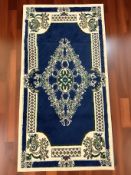 A machine-made rug of Iranian design,