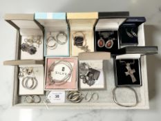 A group of silver/white metal jewellery including pendants, earrings, bracelets,