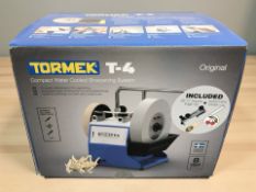 A Tormek T-4 compact water cooled sharpening system, in box.