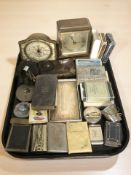 An Elliot mantel clock, various cigarette cases, match vesta, playing cards, etc.