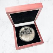 A Queen Elizabeth II 2012 commemorative silver Christmas double crown.